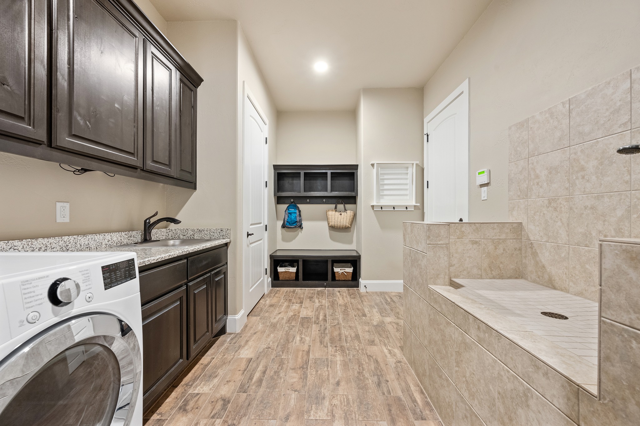 204 Wilderness Trail Georgetown, TX 78633 - Photo 23 of 38 a large kitchen with stainless steel appliances granite countertop a stove and a sink