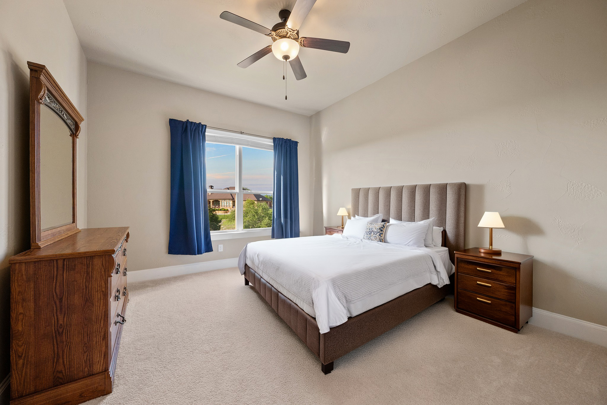 204 Wilderness Trail Georgetown, TX 78633 - Photo 28 of 38 a spacious bedroom with a bed and a flat screen television