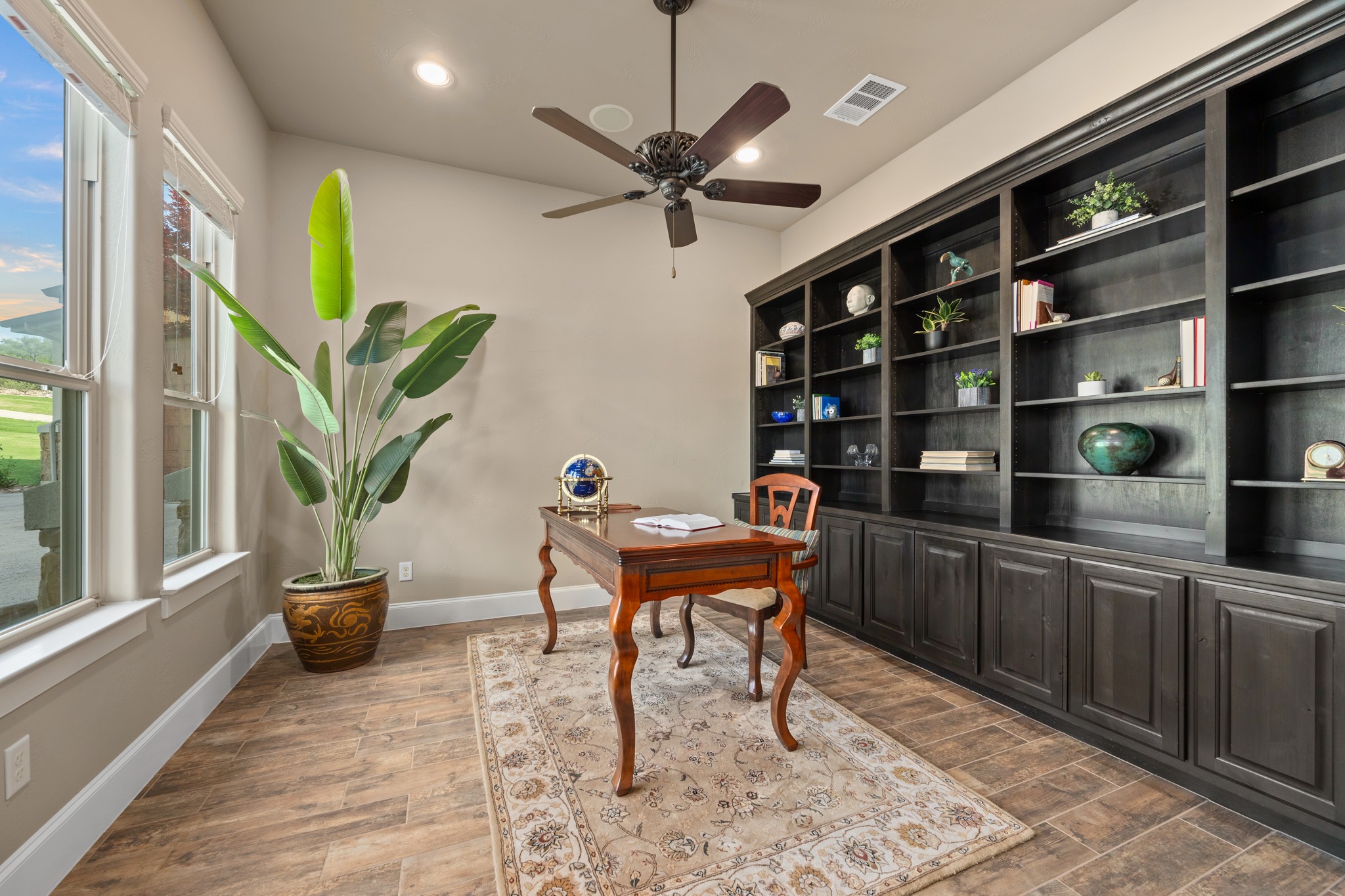 204 Wilderness Trail Georgetown, TX 78633 - Photo 10 of 38 a work room with furniture and book shelf