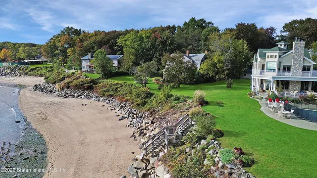 a view of yard with swimming pool and green space
