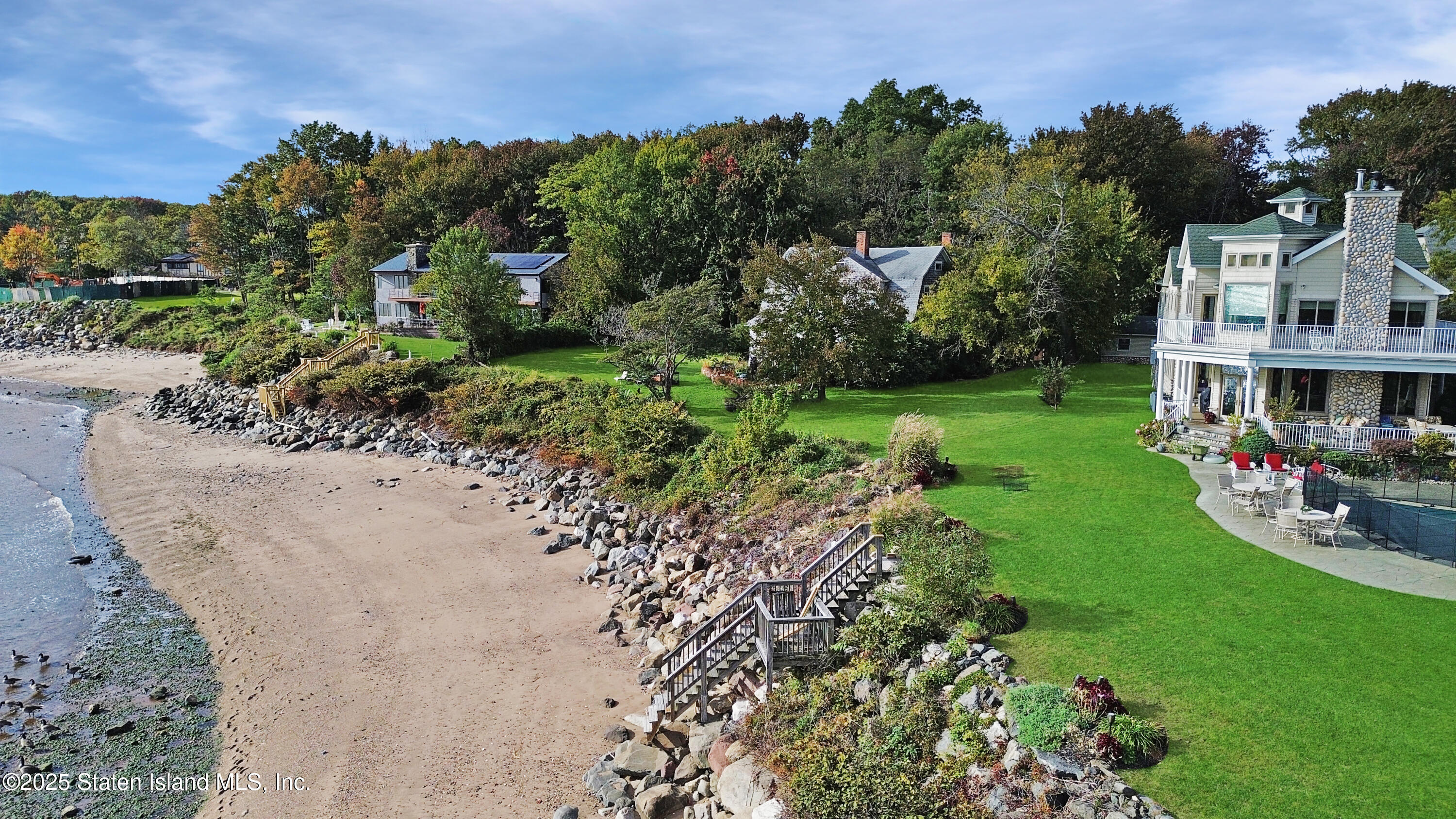 a view of yard with swimming pool and green space