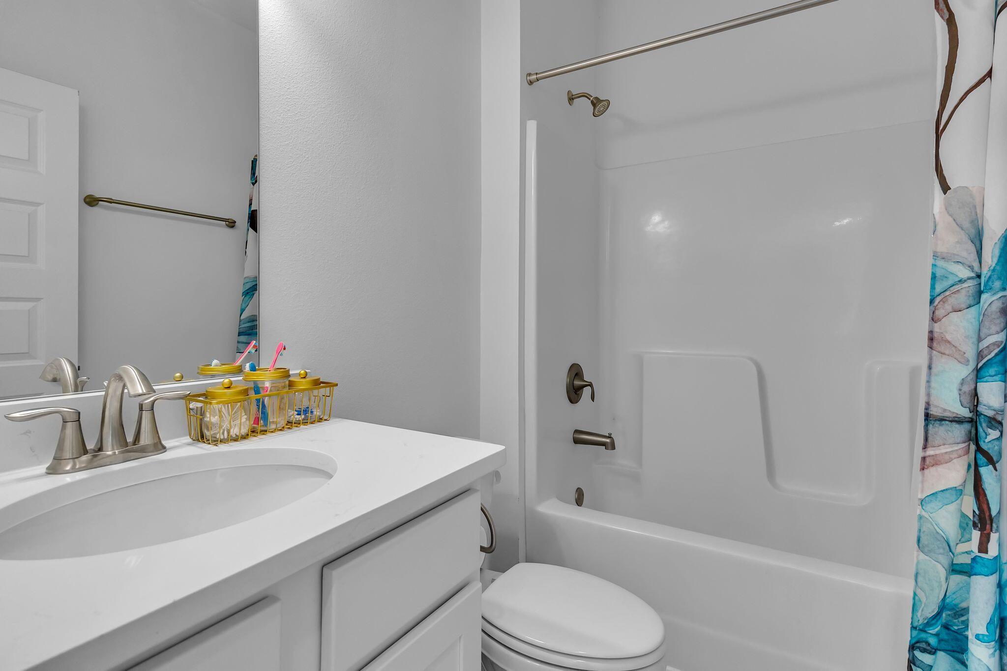 77 Spoonbill Road, Unit LOT 66 Santa Rosa Beach, FL 32459 - Photo 14 of 48 a bathroom with a sink toilet and shower