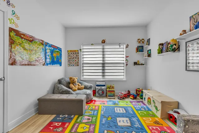 a room with toys and a book shelf