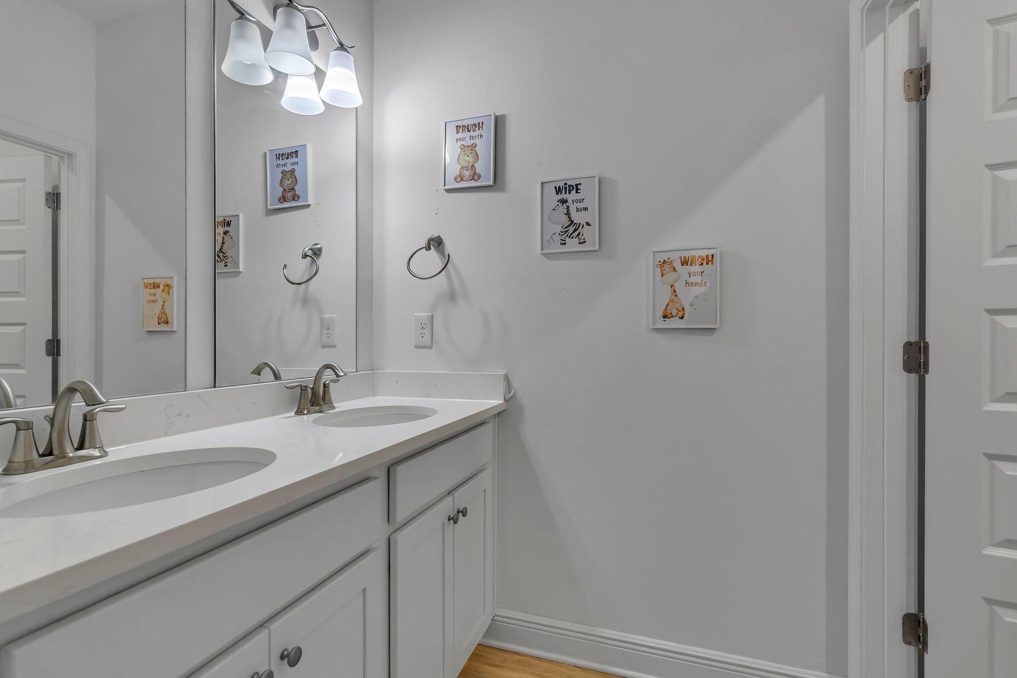 77 Spoonbill Road, Unit LOT 66 Santa Rosa Beach, FL 32459 - Photo 27 of 48 a bathroom with a sink and a mirror
