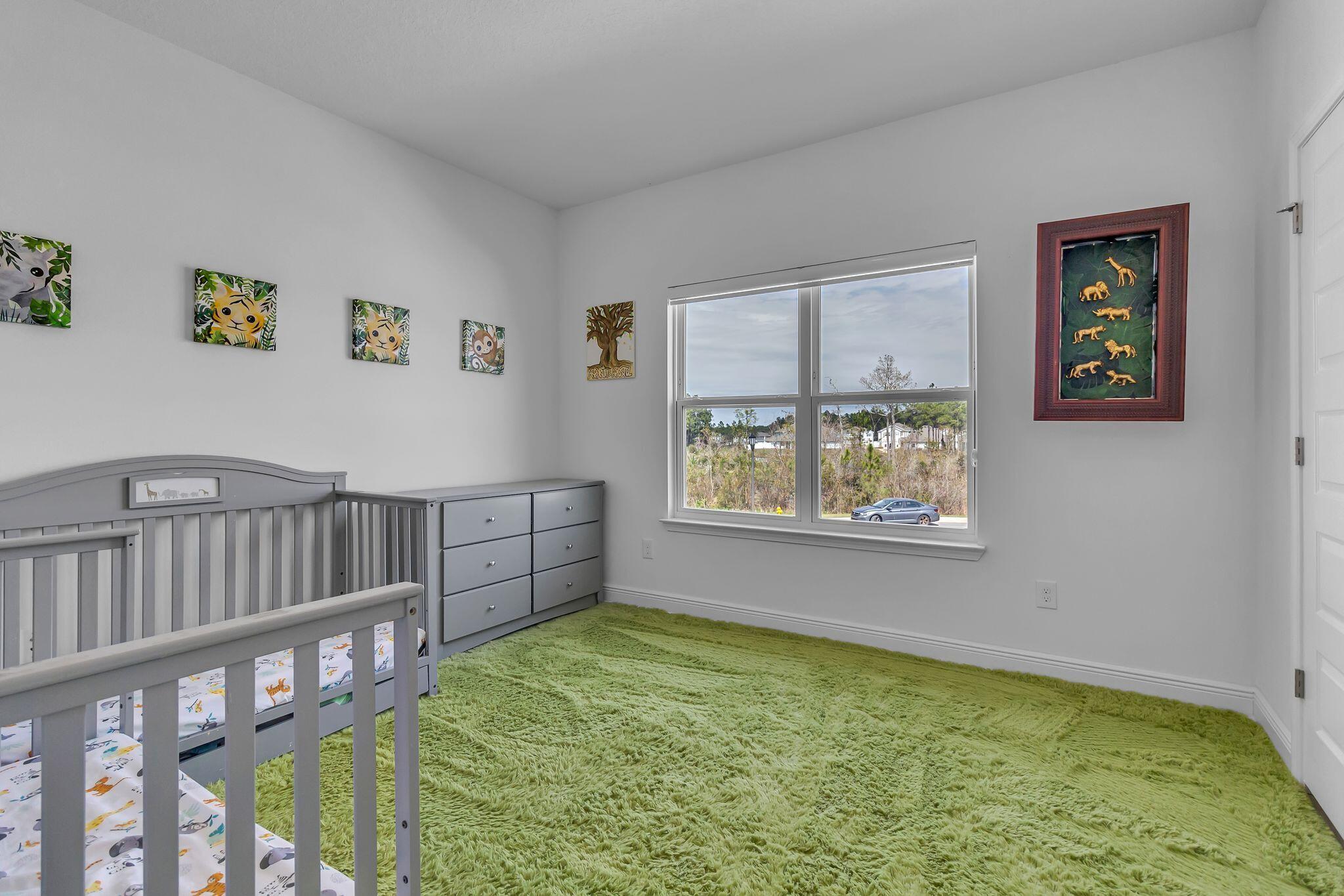 77 Spoonbill Road, Unit LOT 66 Santa Rosa Beach, FL 32459 - Photo 29 of 48 a view of an empty room with window and stairs