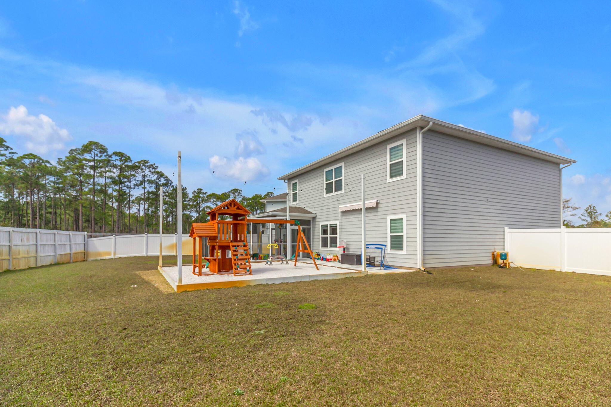 77 Spoonbill Road, Unit LOT 66 Santa Rosa Beach, FL 32459 - Photo 35 of 48 a view of a house with a swimming pool