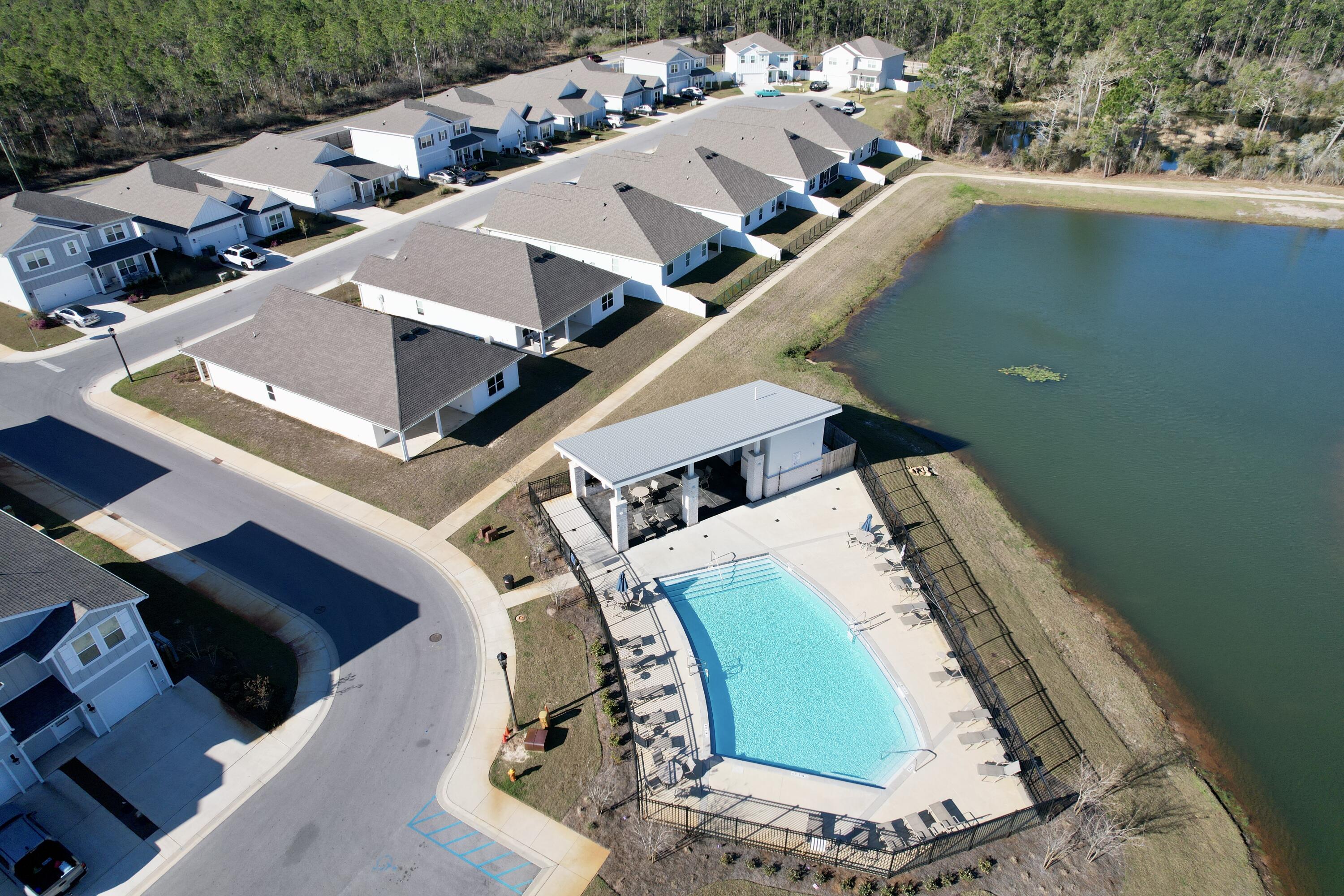 77 Spoonbill Road, Unit LOT 66 Santa Rosa Beach, FL 32459 - Photo 46 of 48 an aerial view of a house with a yard