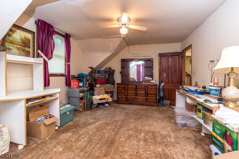 400 Mechlin Corner Road Pittstown, NJ 08867 - Photo 23 of 29 a room with furniture and a flat screen tv