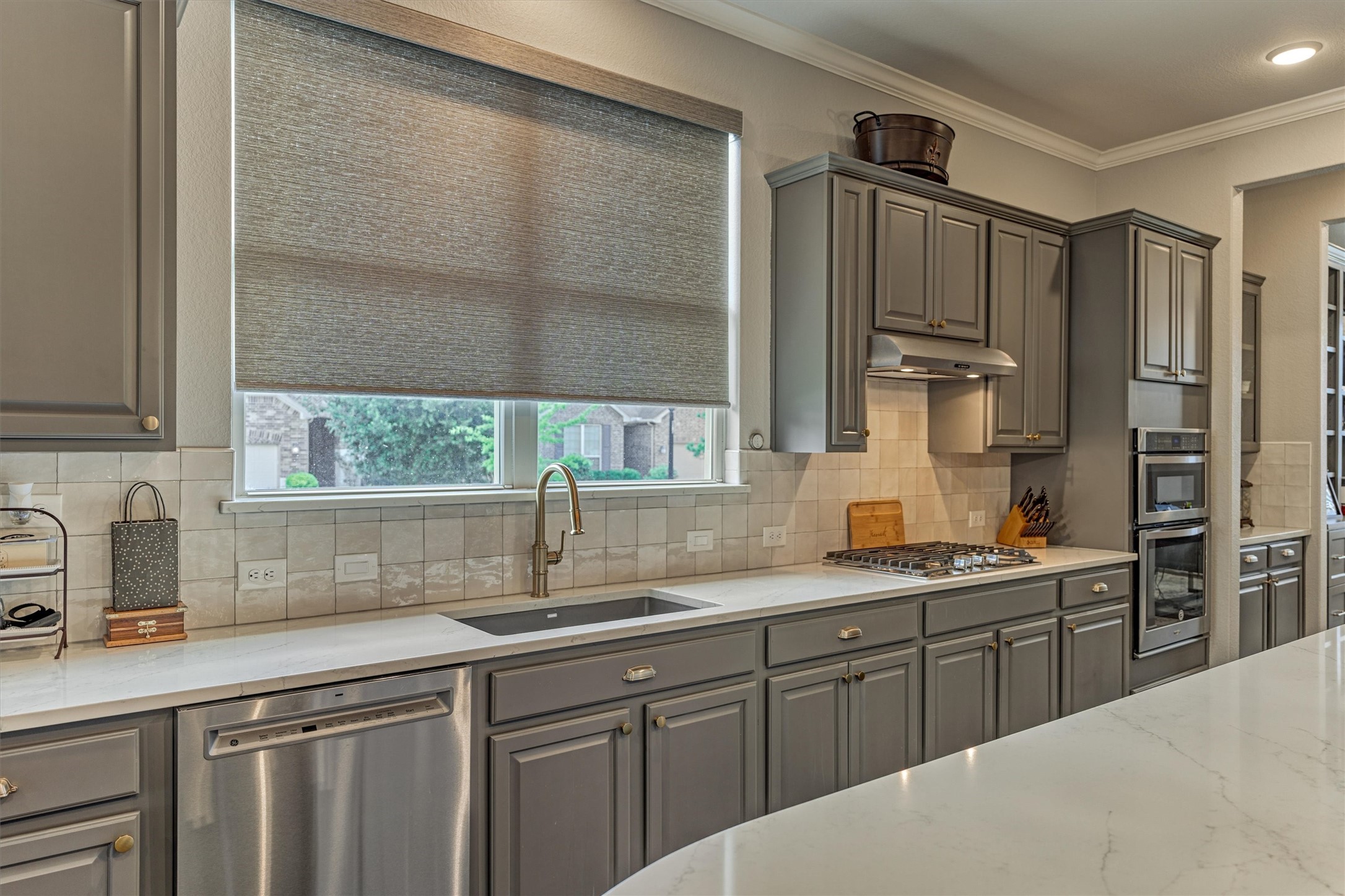 108 Wild Wick Way Spring, TX 77382 - Photo 14 of 44 The Kitchen Also Offers Abundant Quartz Counters, A Tasteful Glazed/Wavy Splash, And Two Large Windows Over The Sink For Checking Out What's Happening Outside!
