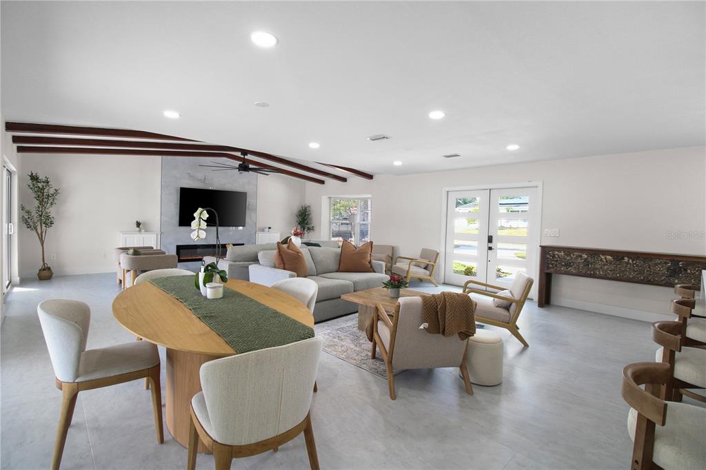 1575 Brookside Boulevard Largo, FL 33770 - Photo 11 of 42 a living room with furniture and a large window
