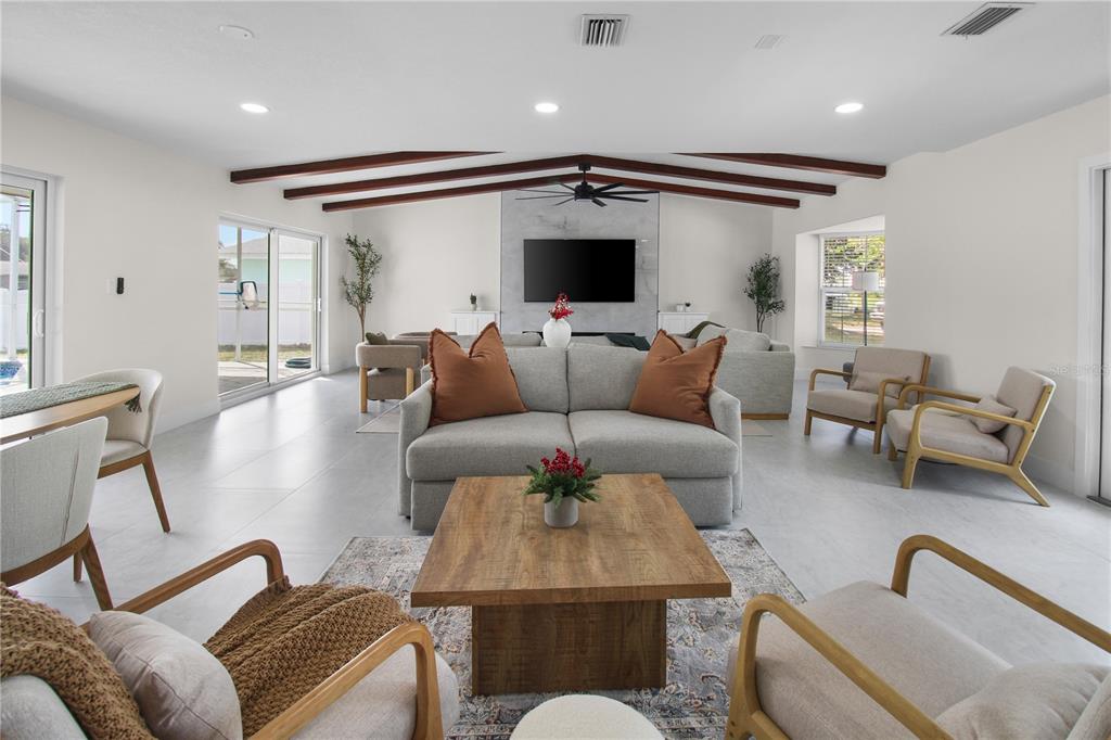 1575 Brookside Boulevard Largo, FL 33770 - Photo 12 of 42 a living room with furniture and a flat screen tv