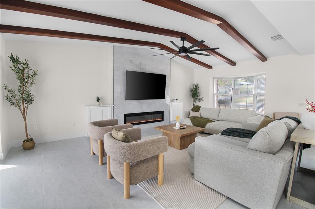 1575 Brookside Boulevard Largo, FL 33770 - Photo 14 of 42 a living room with furniture and a flat screen tv