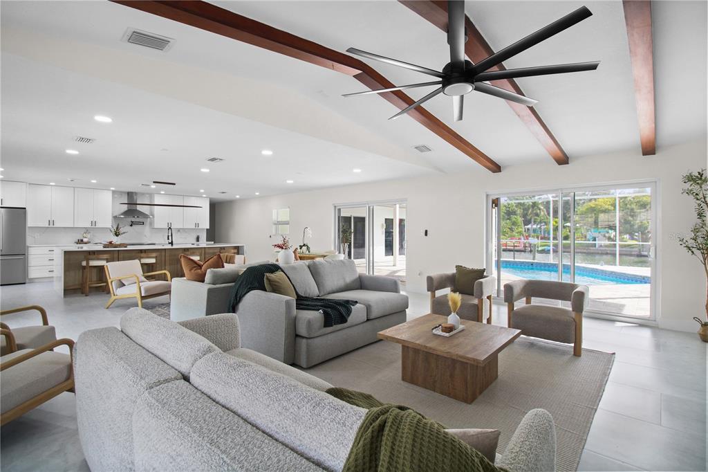 1575 Brookside Boulevard Largo, FL 33770 - Photo 15 of 42 a living room with furniture kitchen view and a large window