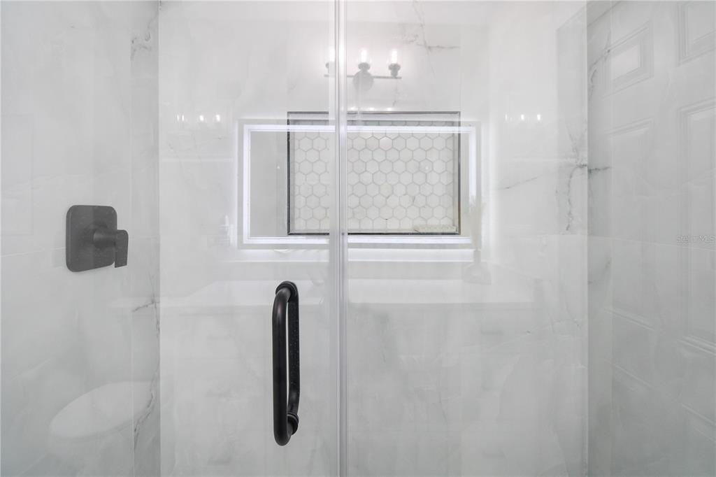 1575 Brookside Boulevard Largo, FL 33770 - Photo 19 of 42 a bathroom with a shower