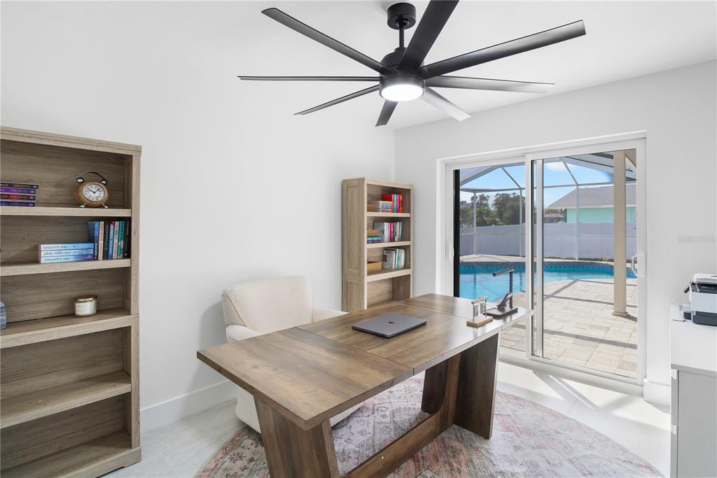 1575 Brookside Boulevard Largo, FL 33770 - Photo 20 of 42 a view of a room that has a table and chairs