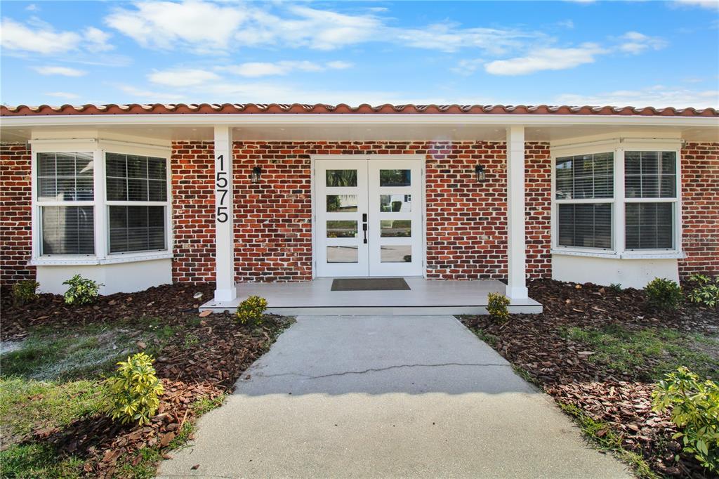 1575 Brookside Boulevard Largo, FL 33770 - Photo 2 of 42 a front view of a house