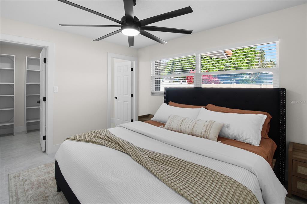 1575 Brookside Boulevard Largo, FL 33770 - Photo 22 of 42 a bedroom with a large bed and a large window