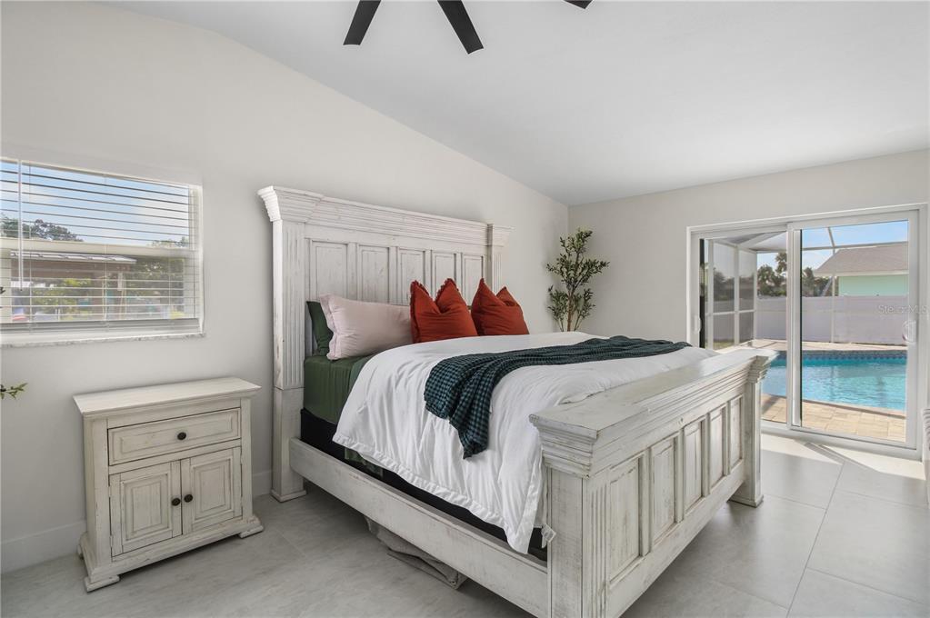 1575 Brookside Boulevard Largo, FL 33770 - Photo 25 of 42 a bedroom with a bed and a dresser
