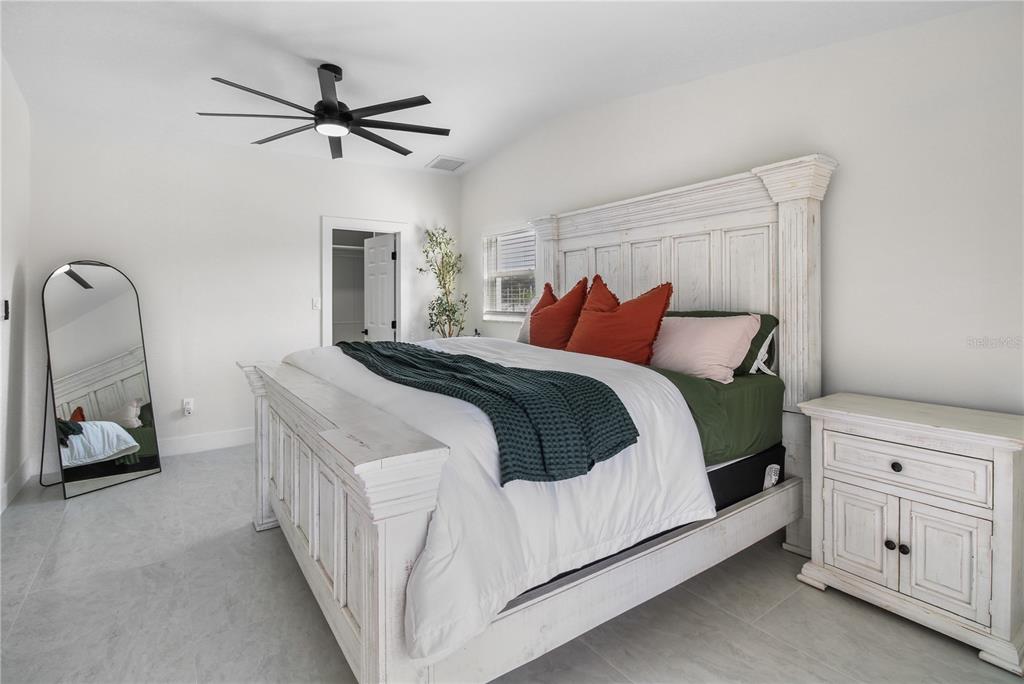 1575 Brookside Boulevard Largo, FL 33770 - Photo 26 of 42 a bedroom with a bed and a dresser