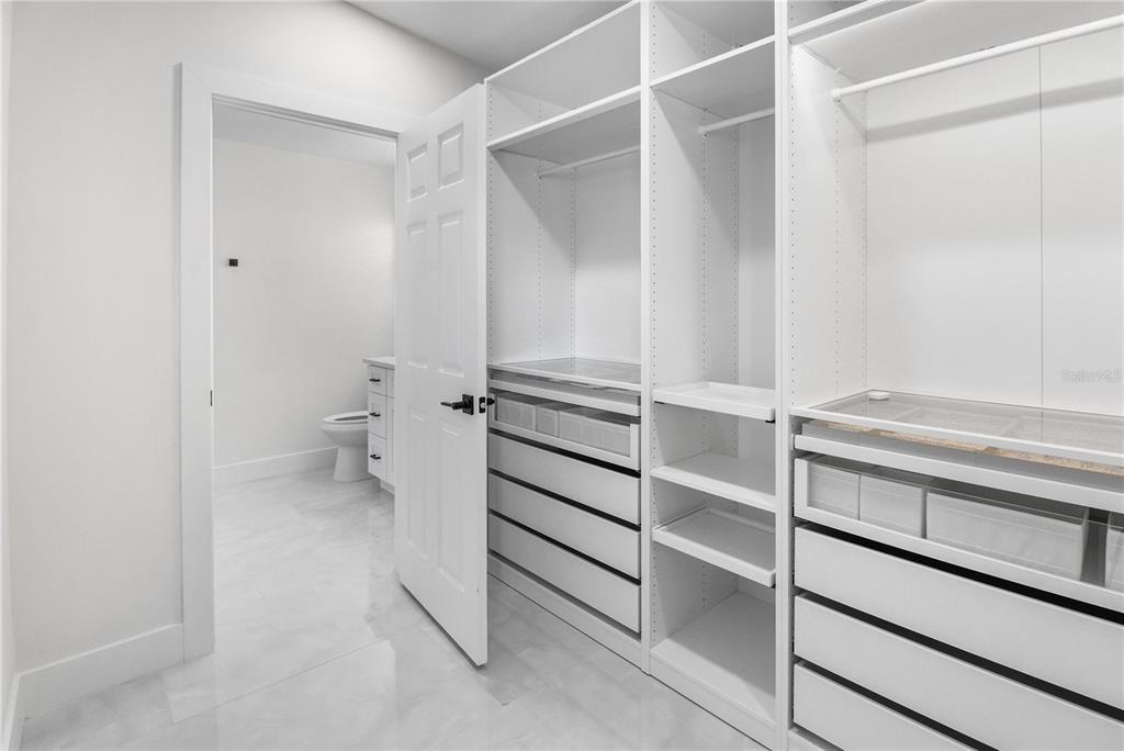 1575 Brookside Boulevard Largo, FL 33770 - Photo 27 of 42 a view of walk in closet with empty racks