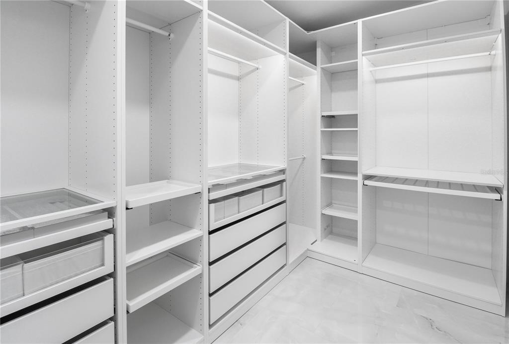 1575 Brookside Boulevard Largo, FL 33770 - Photo 28 of 42 a view of walk in closet with empty racks
