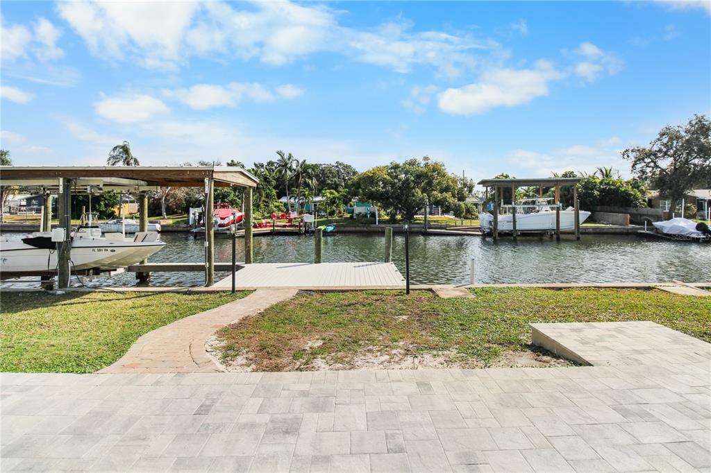 1575 Brookside Boulevard Largo, FL 33770 - Photo 37 of 42 a view of a swimming pool with a lake view