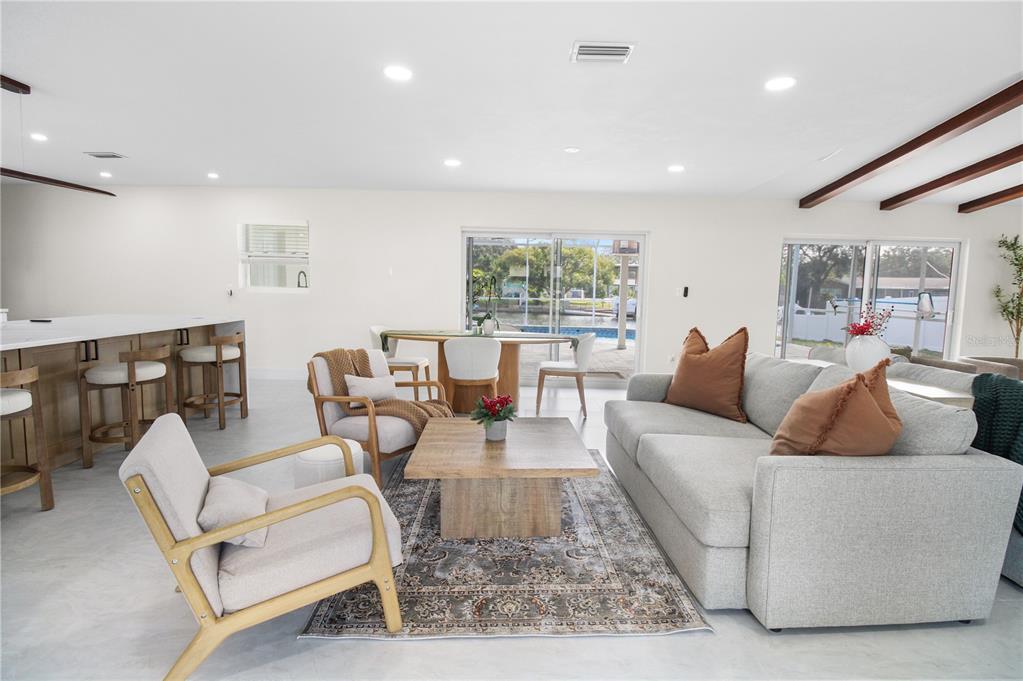 1575 Brookside Boulevard Largo, FL 33770 - Photo 6 of 42 a living room with furniture and a large window
