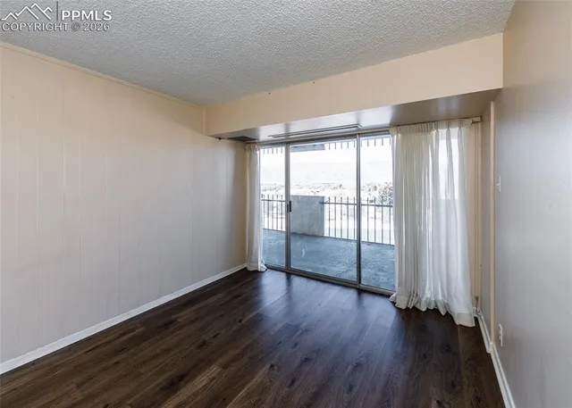 a view of a glass door and wooden floor
