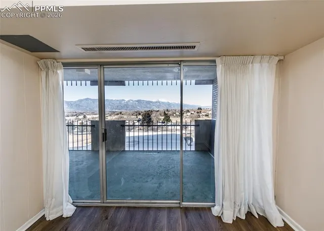 a bathroom with a granite countertop sink toilet a mirror and shower
