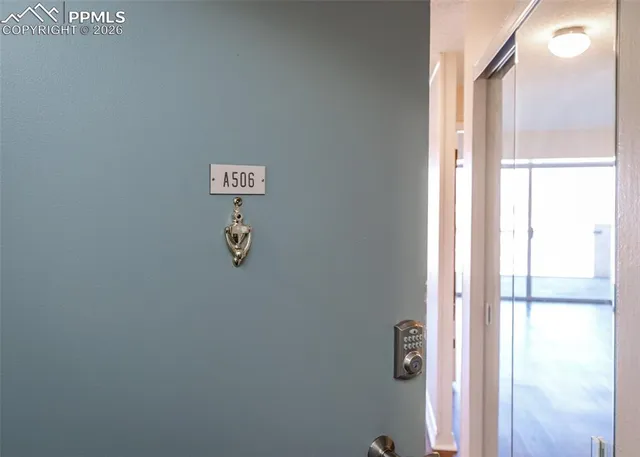 a kitchen with a sink cabinets and wooden floor