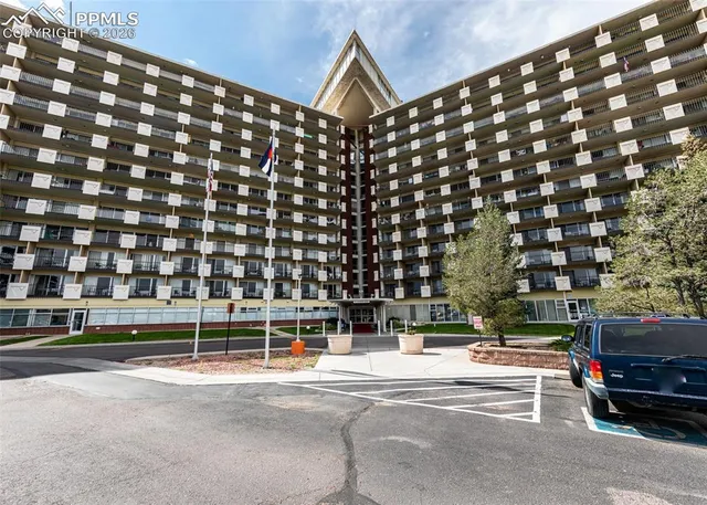 a kitchen with a sink appliances and cabinets
