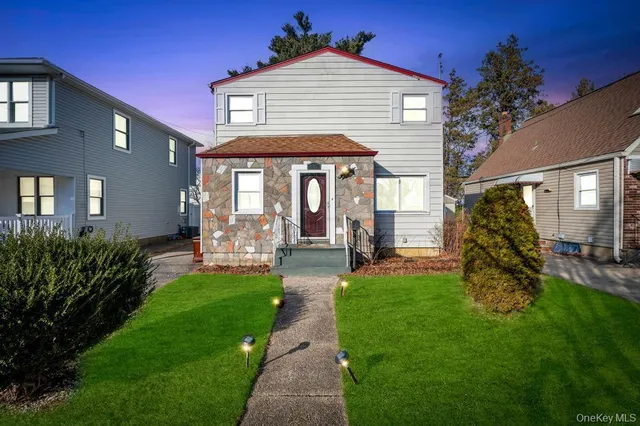 a view of a house with a yard porch and sitting area