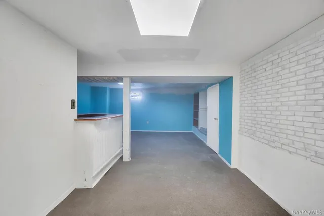 a view of hallway with an empty room