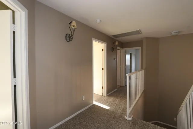 a view of a hallway with closet area