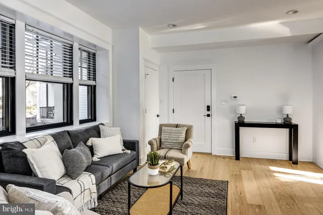 a living room with furniture and a rug