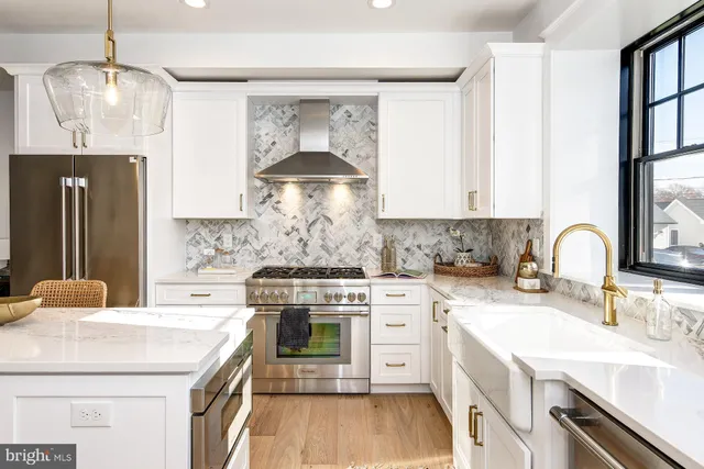 a stove top oven sitting inside of a kitchen