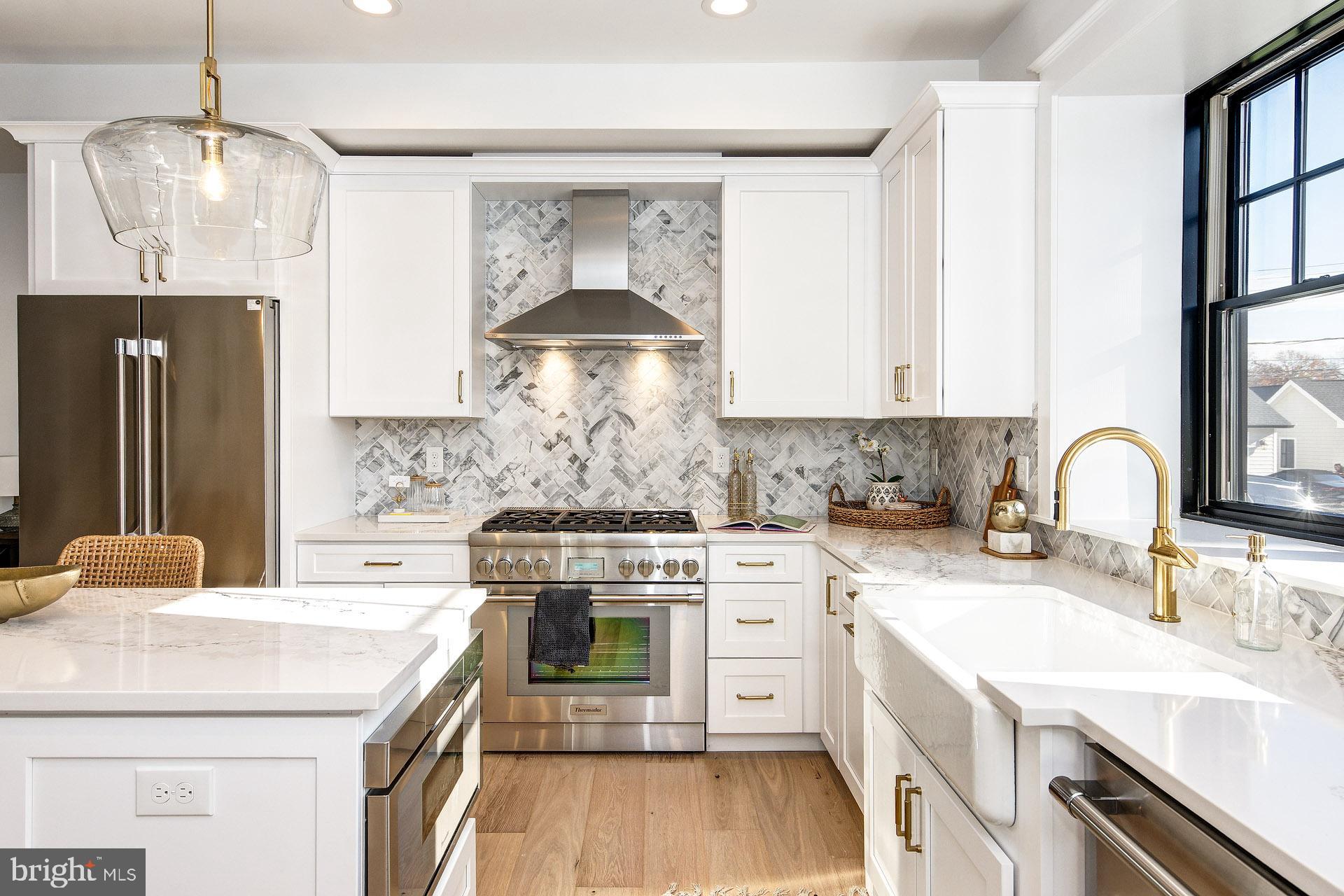 20 East Redman Avenue, Unit B Haddonfield, NJ 08033 - Photo 17 of 43 a kitchen with stainless steel appliances a sink stove and cabinets