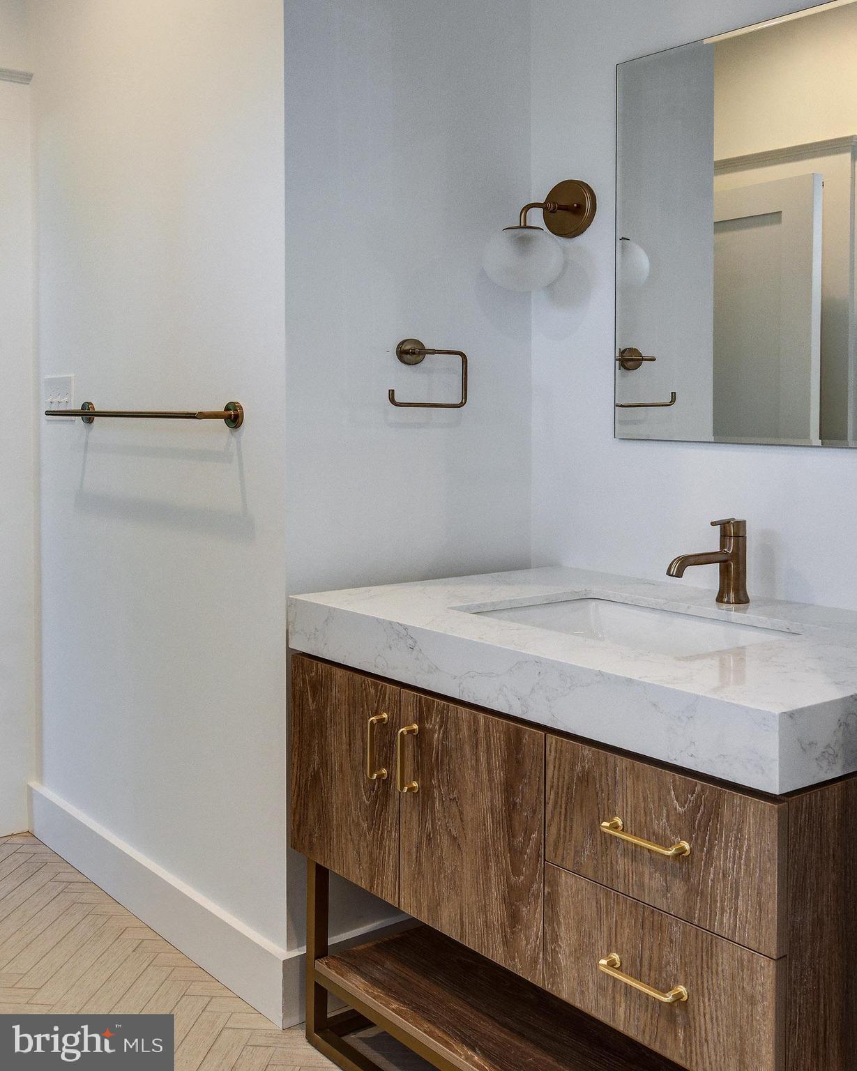 20 East Redman Avenue, Unit B Haddonfield, NJ 08033 - Photo 35 of 43 a bathroom with a sink and a mirror