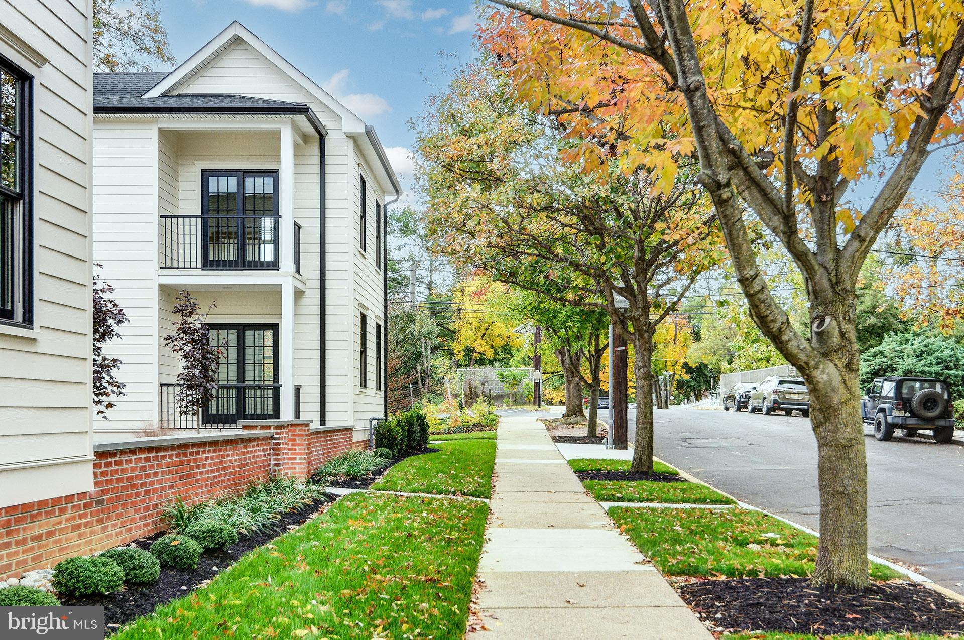 20 East Redman Avenue, Unit B Haddonfield, NJ 08033 - Photo 7 of 43 a front view of a house with a yard and fountain