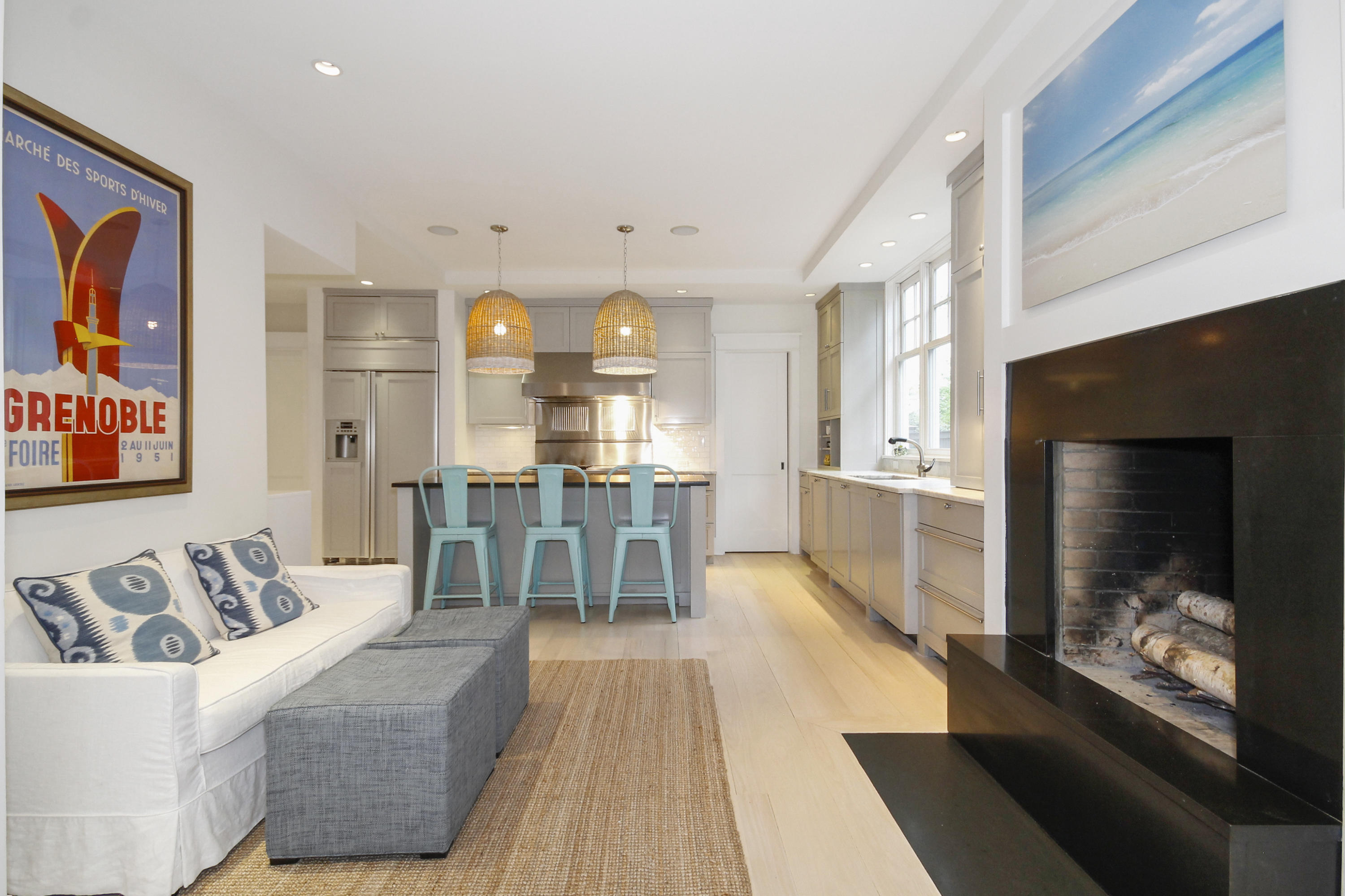 2 Rowayton Avenue Rowayton, CT 06853 - Photo 11 of 43 a living room with furniture a fireplace and a flat screen tv
