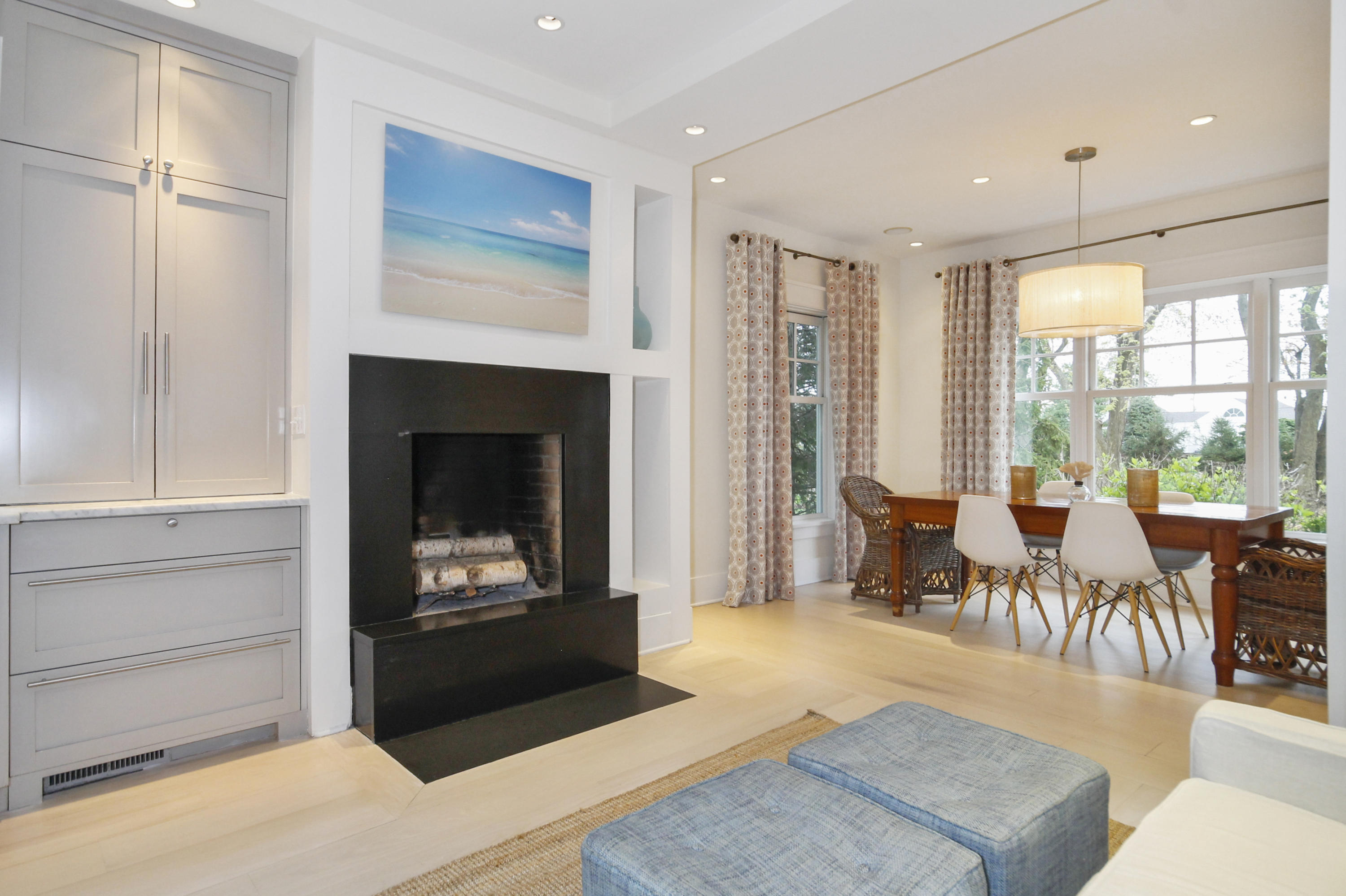 2 Rowayton Avenue Rowayton, CT 06853 - Photo 12 of 43 a living room with furniture a fireplace and a table