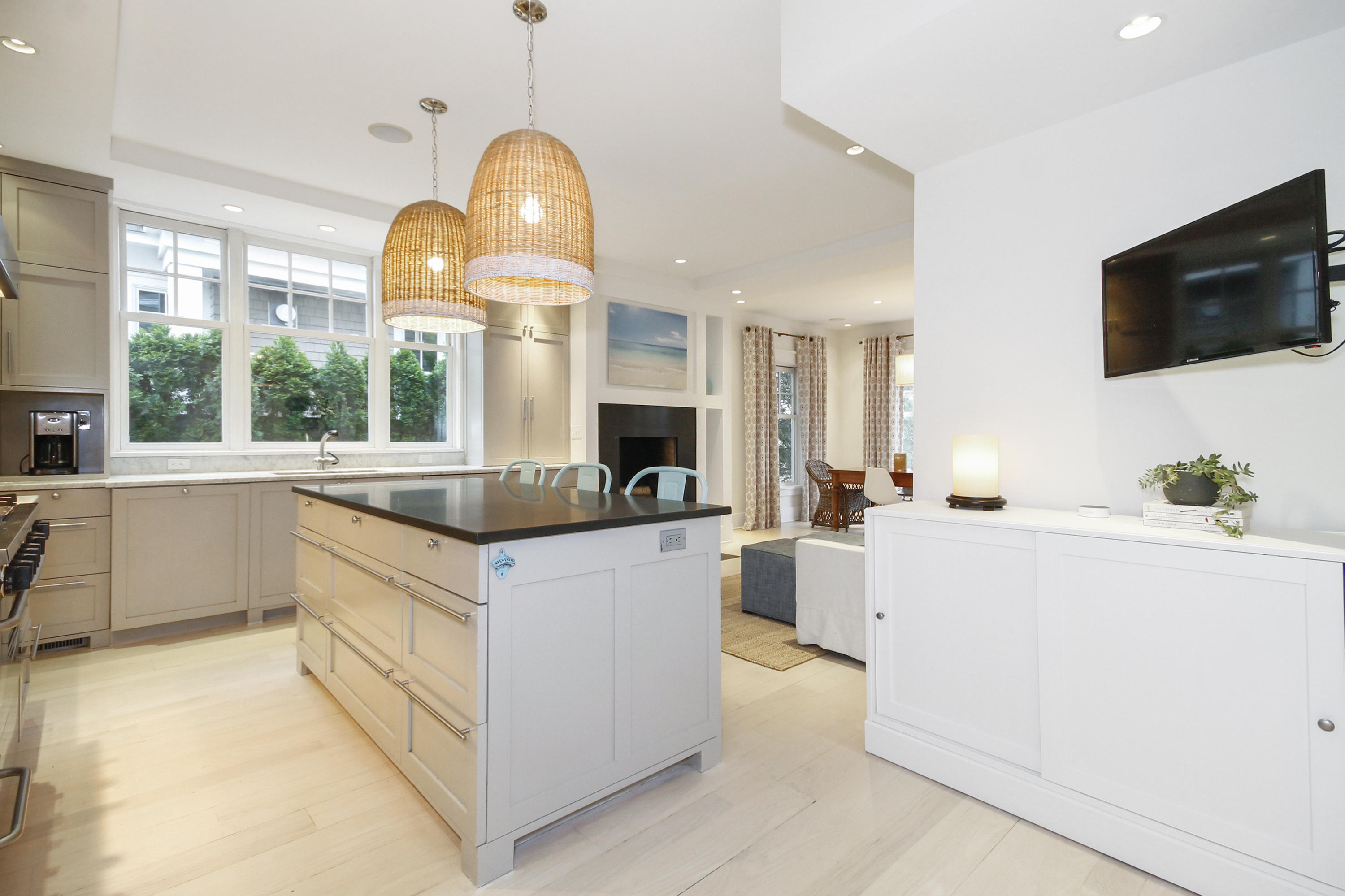 2 Rowayton Avenue Rowayton, CT 06853 - Photo 13 of 43 a large kitchen with kitchen island a large counter space and a view of living room