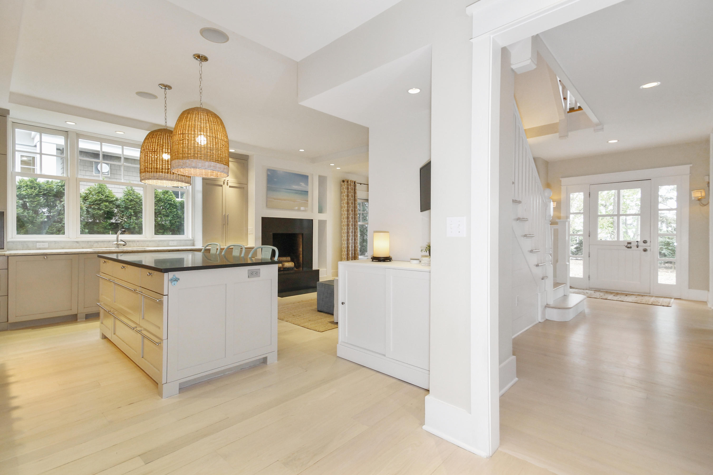 2 Rowayton Avenue Rowayton, CT 06853 - Photo 18 of 43 a large white kitchen with granite countertop a large window and a refrigerator
