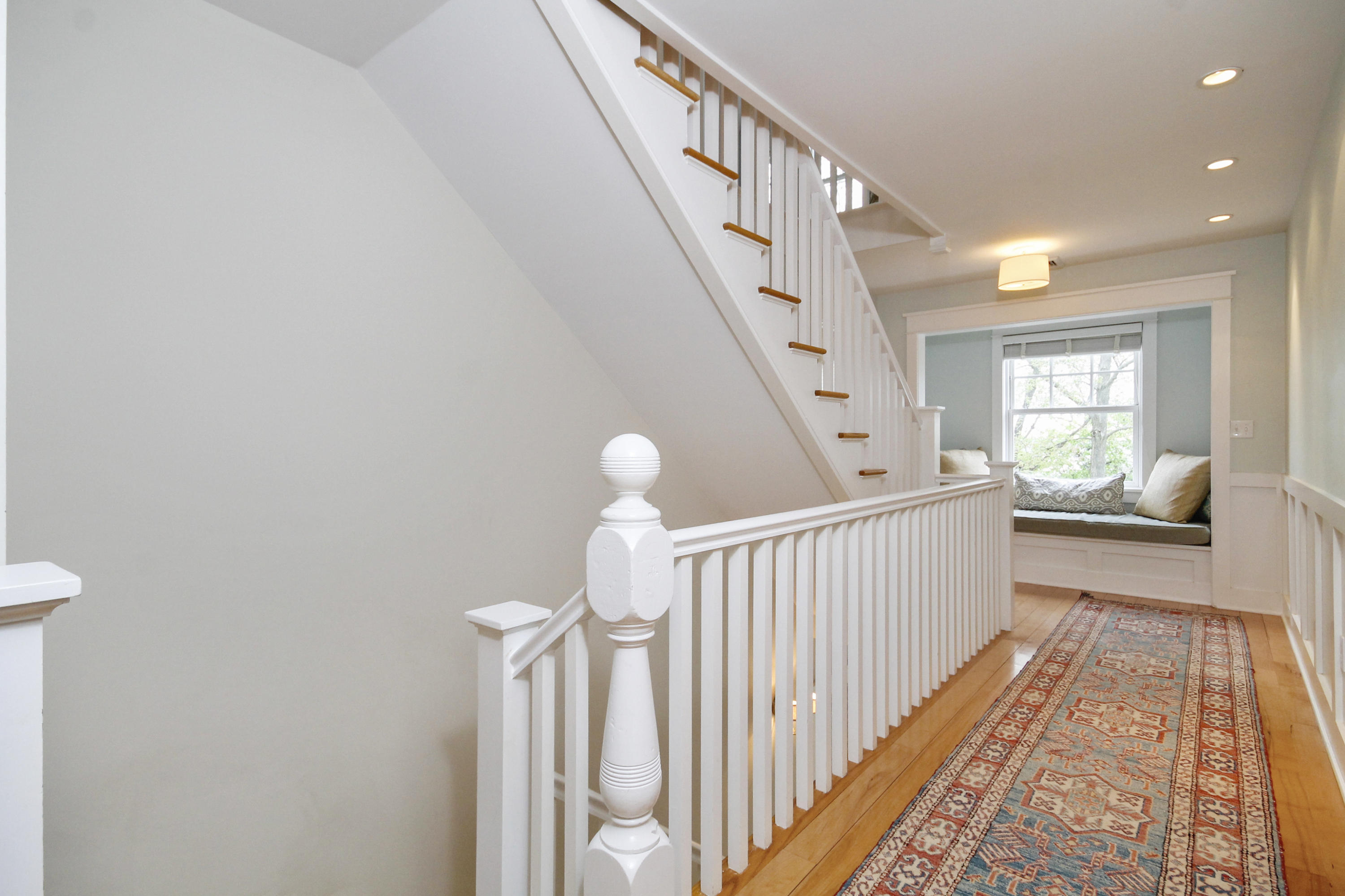 2 Rowayton Avenue Rowayton, CT 06853 - Photo 23 of 43 a view of a hallway with wooden floor and staircase