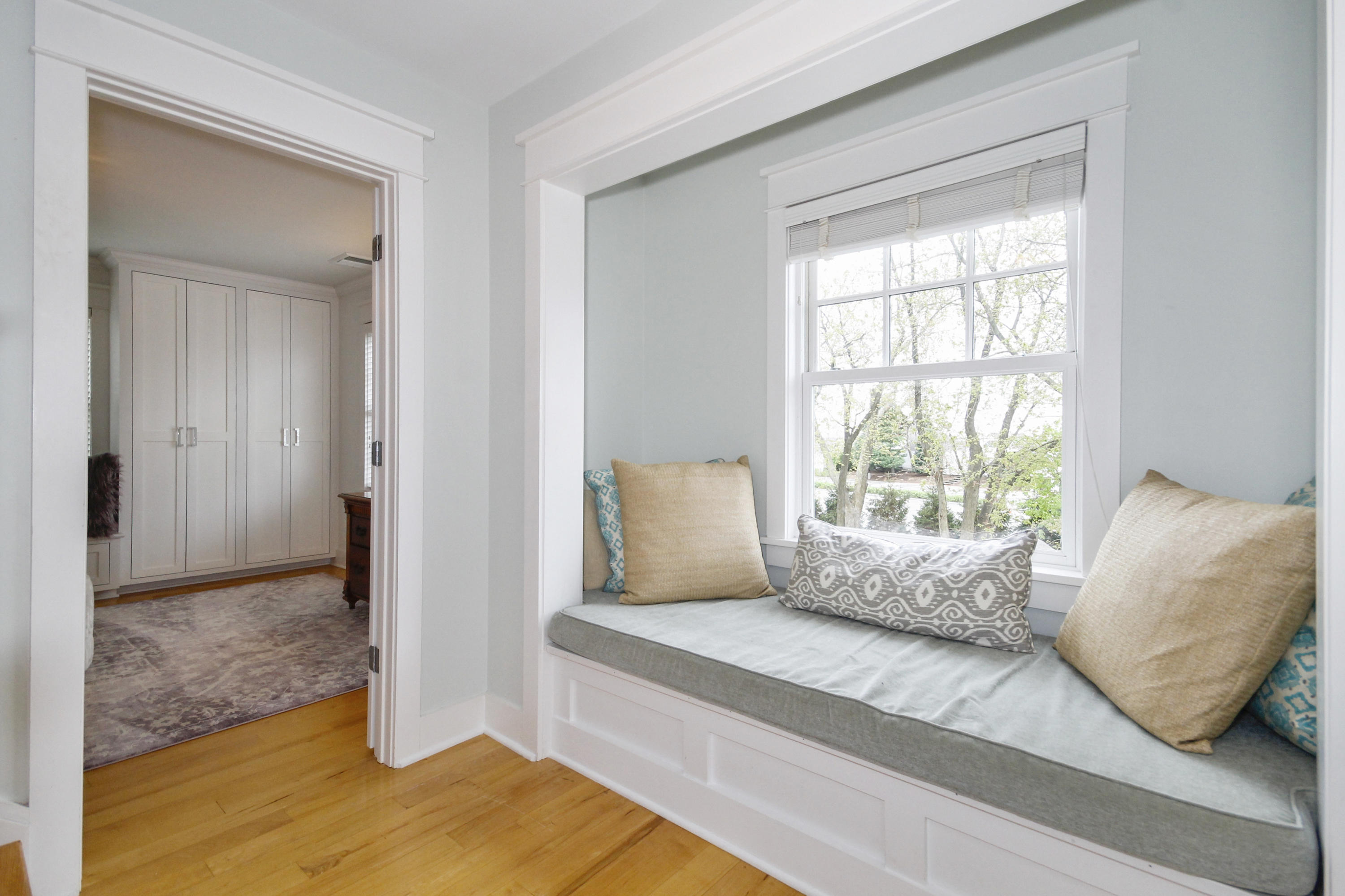 2 Rowayton Avenue Rowayton, CT 06853 - Photo 24 of 43 a bedroom with a bed and wooden floor