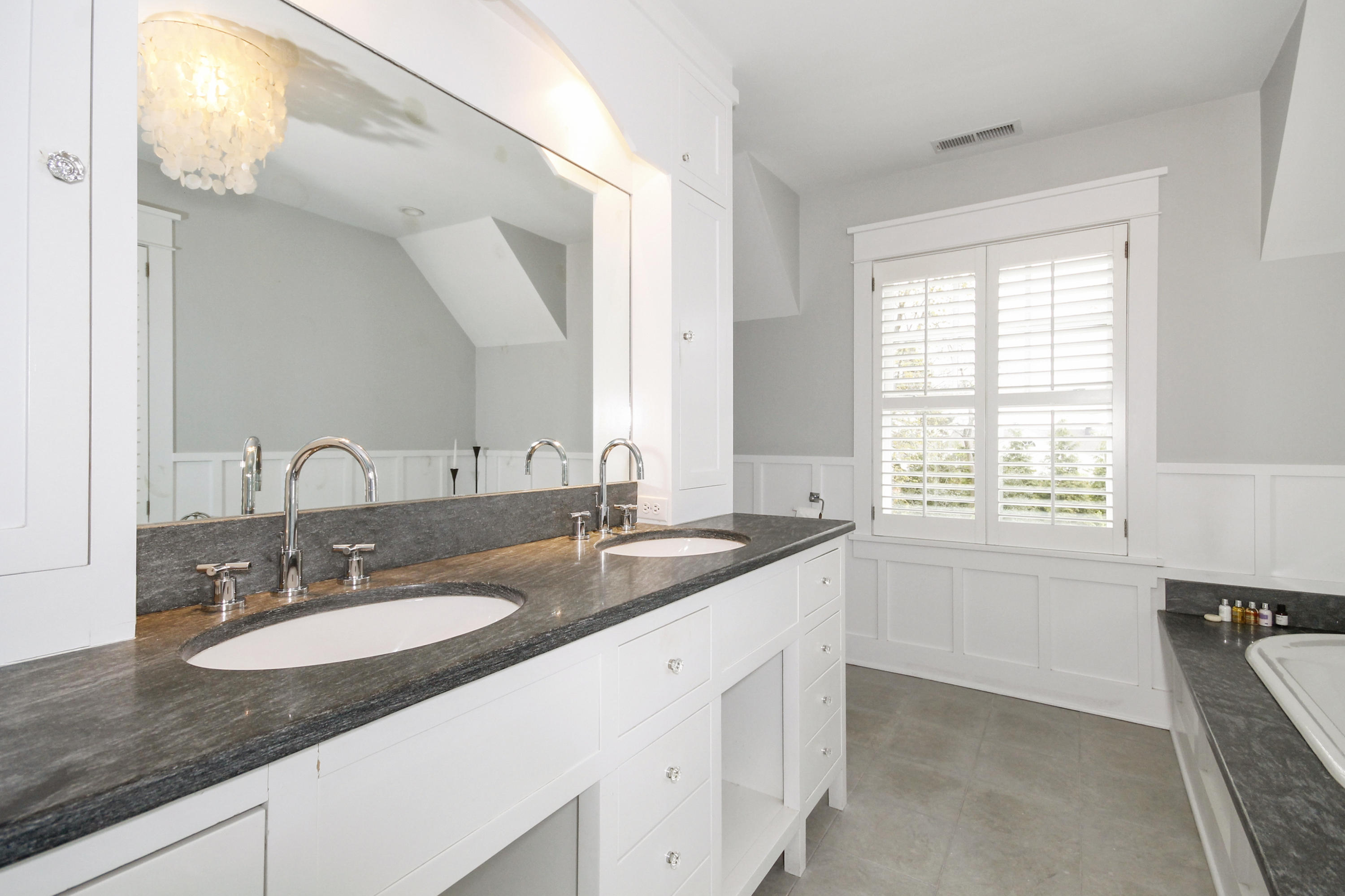 2 Rowayton Avenue Rowayton, CT 06853 - Photo 26 of 43 a bathroom with a granite countertop sink and a mirror