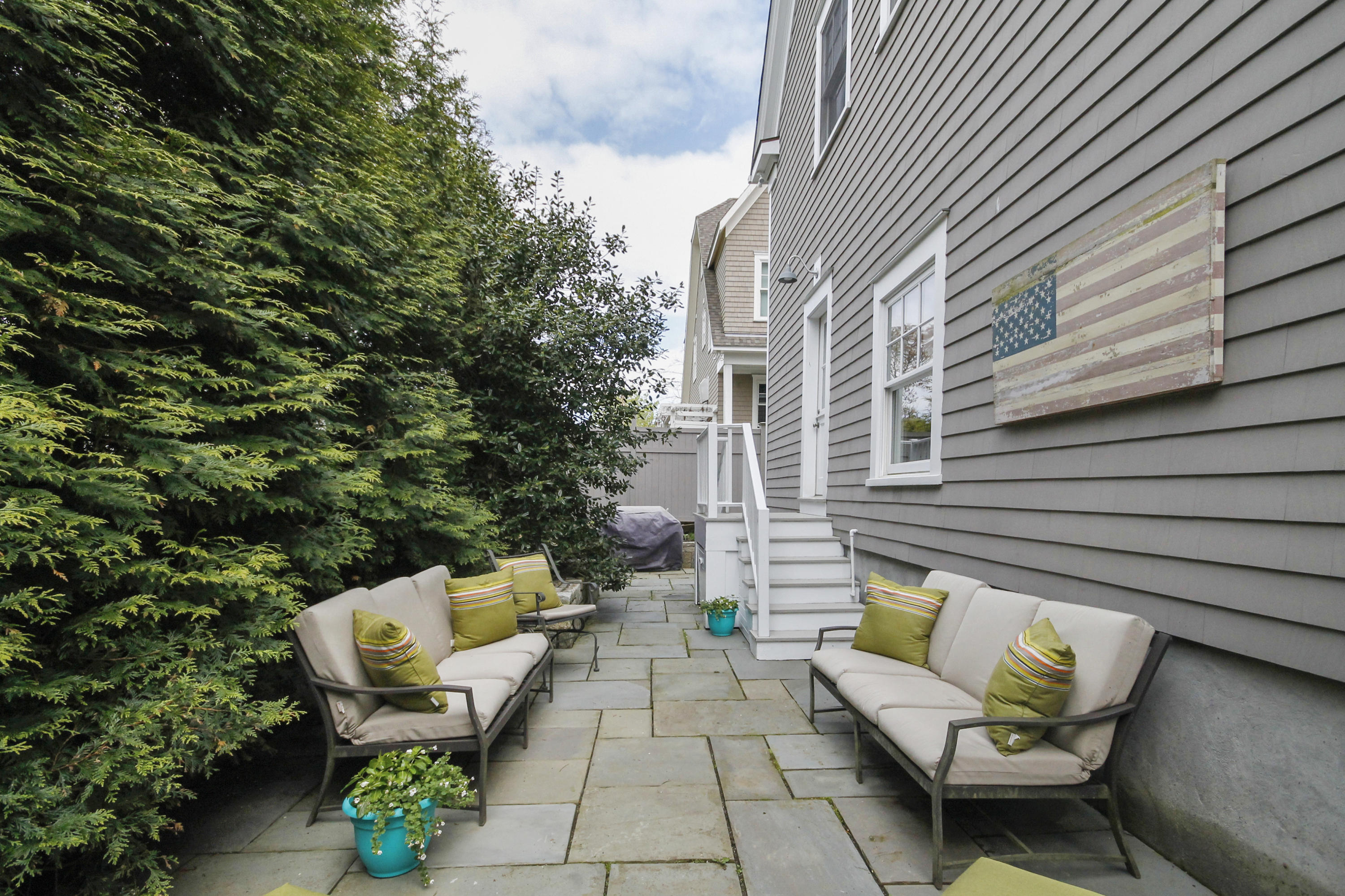 2 Rowayton Avenue Rowayton, CT 06853 - Photo 38 of 43 a view of a patio with couple of chairs and a fire pit