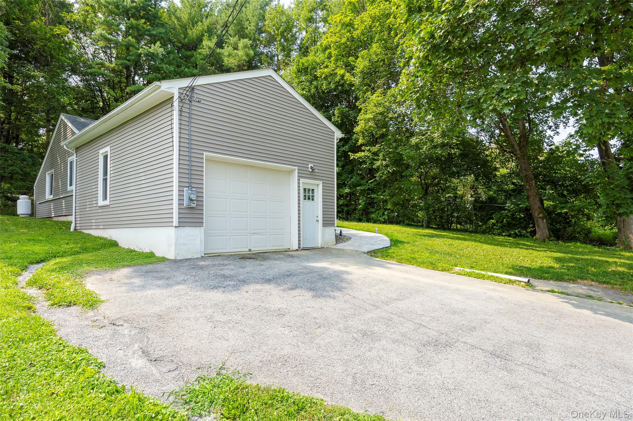 148 Bower Road Poughkeepsie, NY 12603 - Photo 18 of 19 a view of backyard of house with large trees