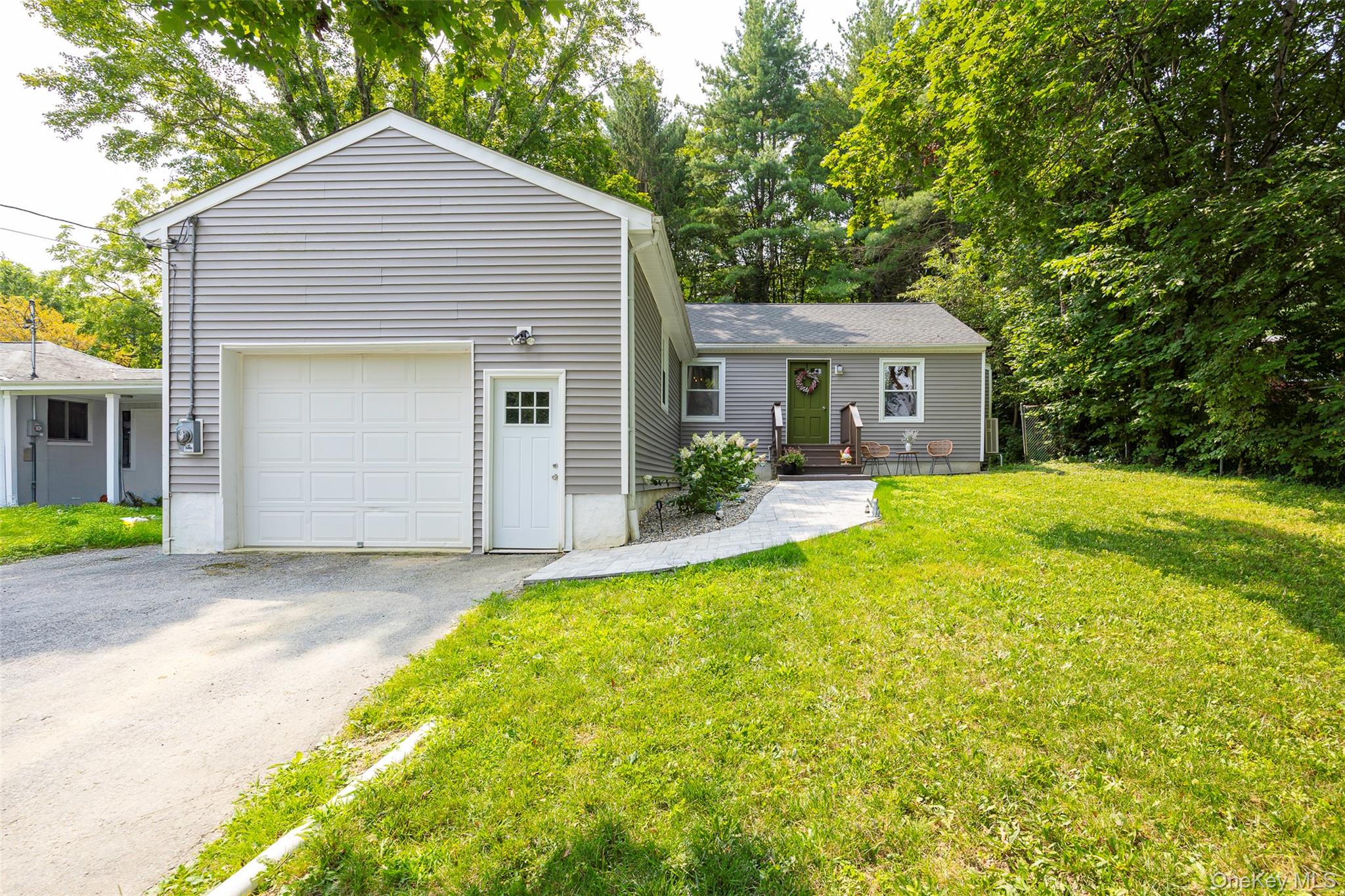 148 Bower Road Poughkeepsie, NY 12603 - Photo 19 of 19 a view of a house with a yard and potted plants