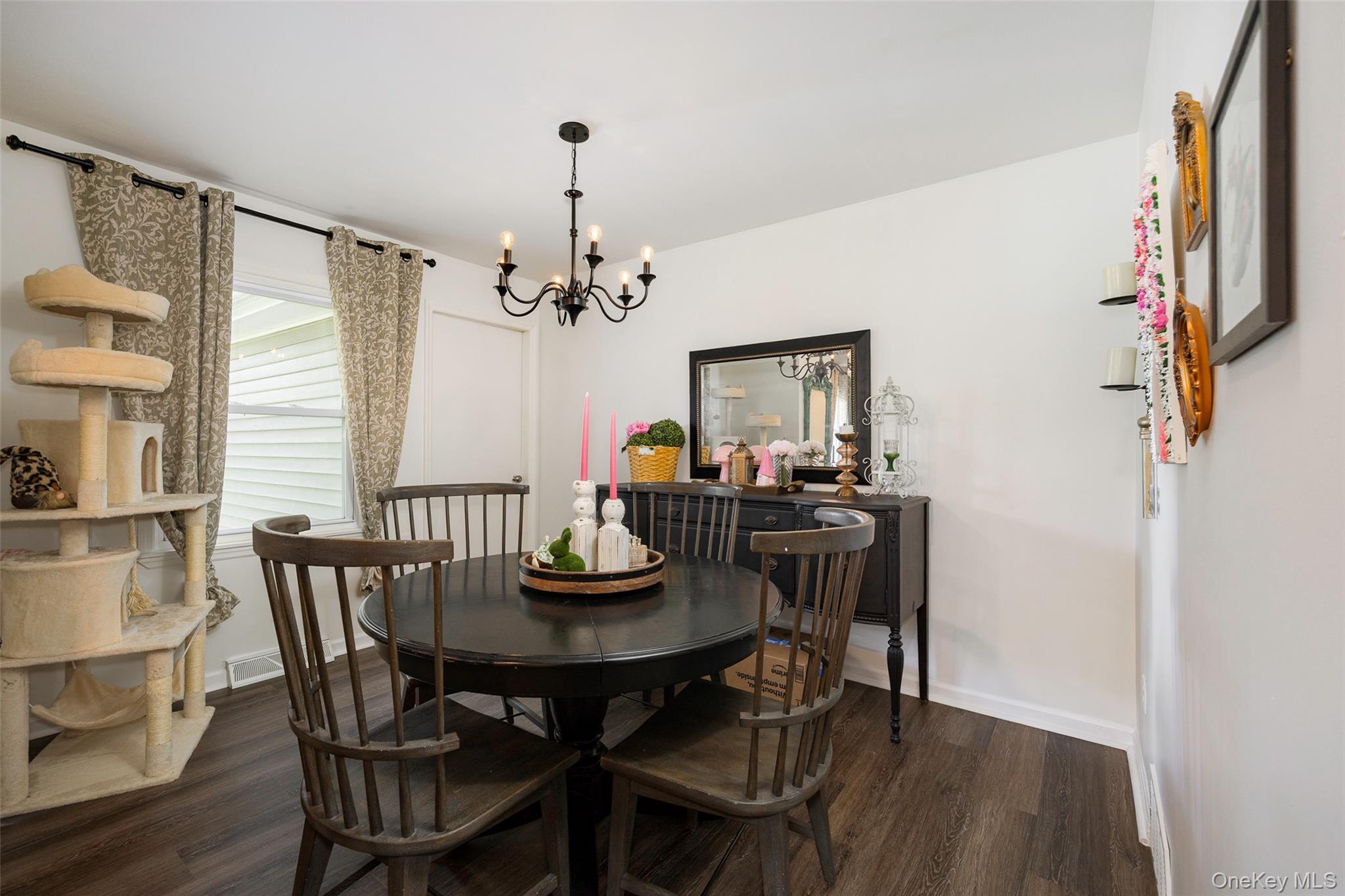 148 Bower Road Poughkeepsie, NY 12603 - Photo 5 of 19 a view of a dining room with furniture and wooden floor